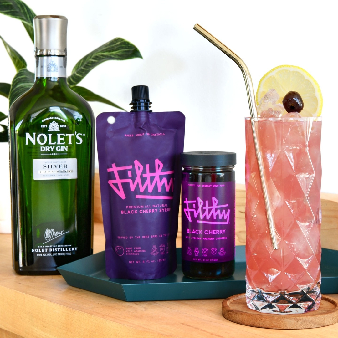 Welcome to our Filthy Lemonade Stand 🍋🍒 1.5 oz NOLET’S Silver Gin 0.5 oz Filthy® Black Cherry Syrup 4 oz Simply Lemonade Garnish with a Filthy® Black Cherry. 📸: @noletsgins #LetsGetFilthy #FilthyForLife #LemonadeCocktail #BoozyLemonade