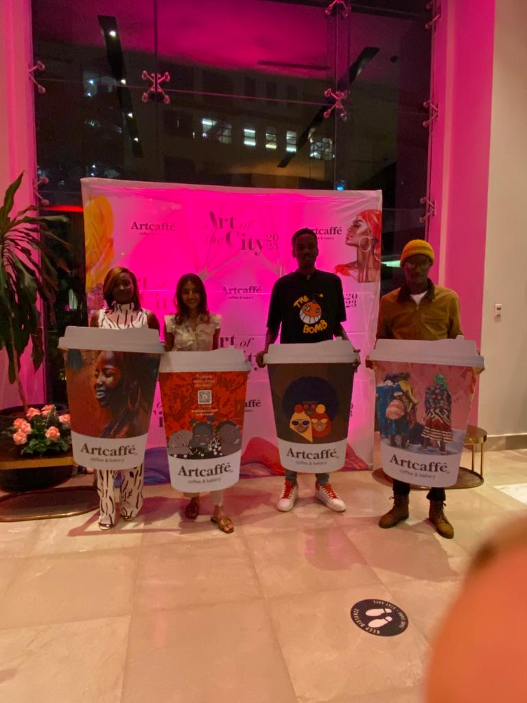 In picture are the winners of the 2nd edition of the  #artofthecity that were awarded  beautiful giant cups with their art on them and cash prizes 
#Artcaffe  #Herstory