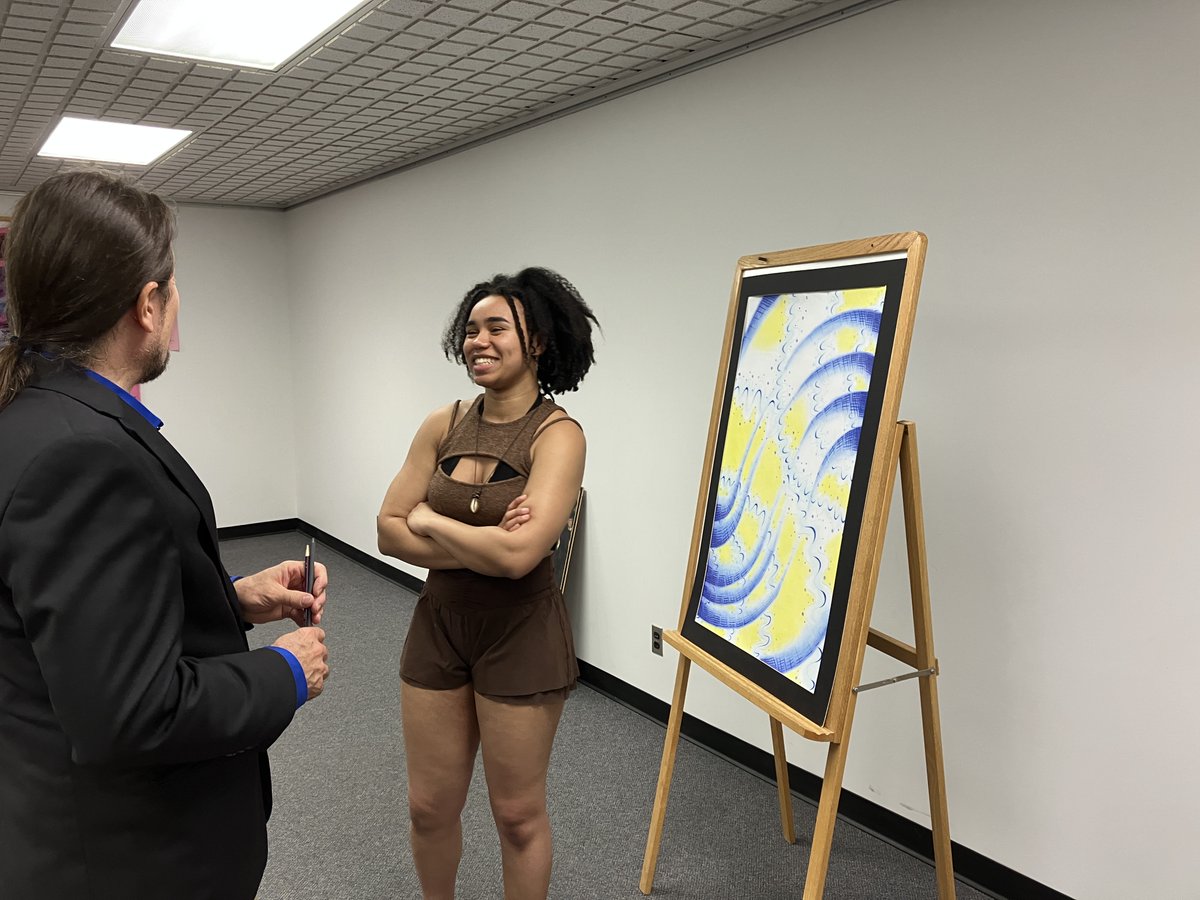 BealLibrary's tweet photo. @bealart star Esther Clarke pops into @HBBeal Library and chats with Mr. Weaver to see where her mesmerizing 2022 painting "Vibrations" has been on display in the Raider Gallery for everyone to enjoy.

We wish everyone an enjoyable summer.

Read some, eh! 📚 https://t.co/OKwe1Ez2hS