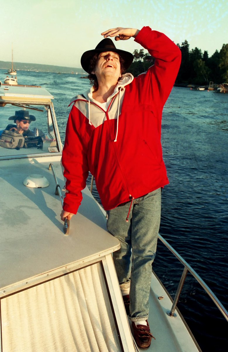 Bob Dylan sails on the Oslo Fjord, 1991. From one of the most mind-boggling Dylan photo shoots ever. 📸: Line Møller. #BobDylan #Dylan