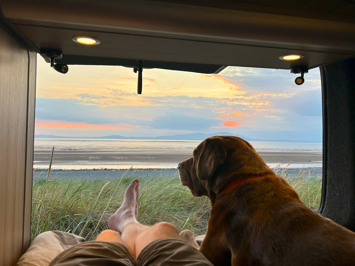 Northlakesuk's tweet photo. Perfect chill out time watching the tide come in from my bed with some decent tunes playing and more importantly man’s best friend by my side ❤️ #vanlife https://t.co/n6L8vcKwC4