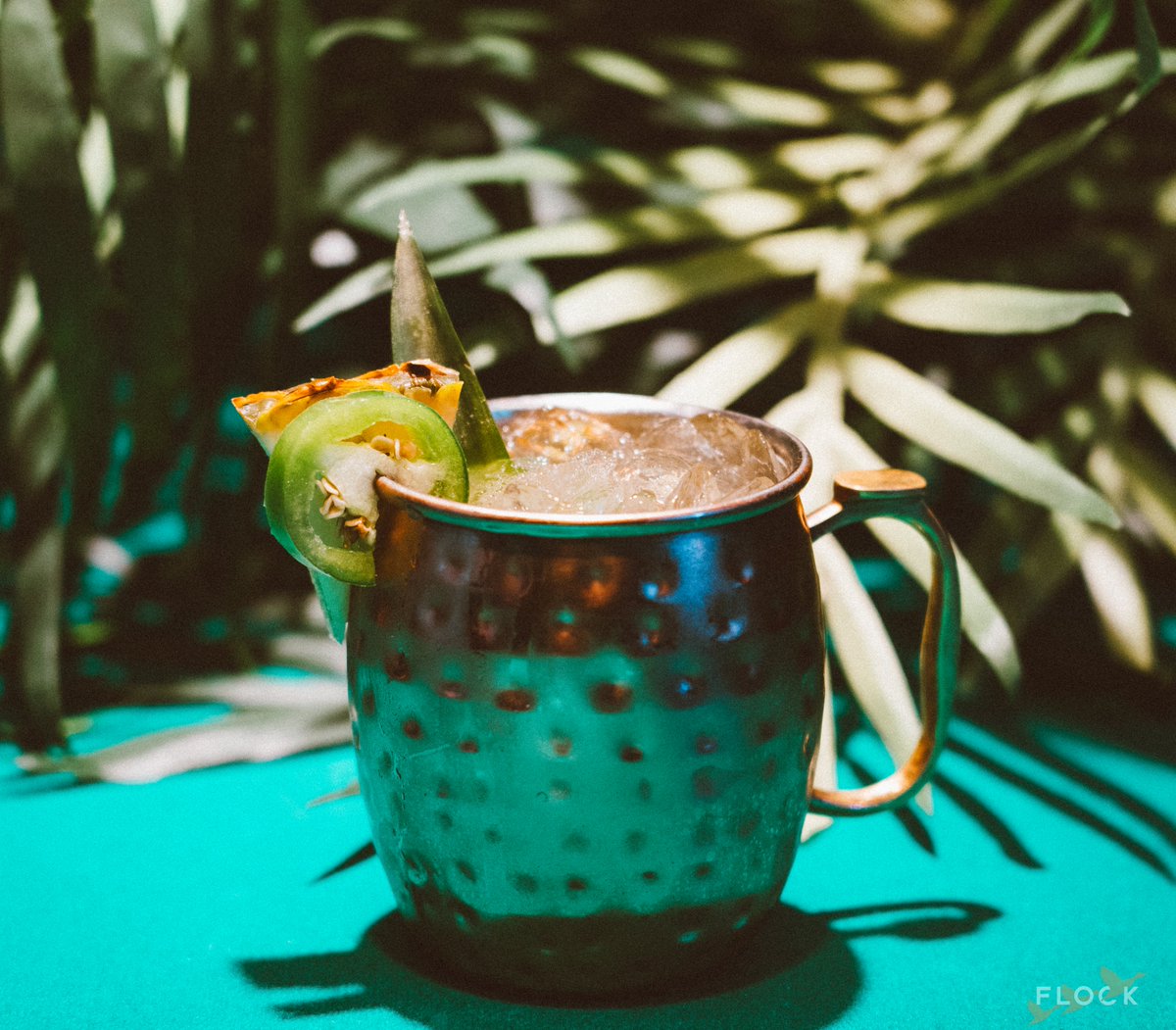 flockbarcc's tweet photo. Crafted by our talented bartender Alicia. Experience the smoky allure of Del Maguey Mezcal, complemented by the zesty kick of Cointreau and Lime. Sweetened with Agave/Pineapple Juice. Don't forget the fiery Jalapeno slices to take it up a notch! 🌶️ Topped off with Ginger Beer! https://t.co/1Y2kB6s1QQ