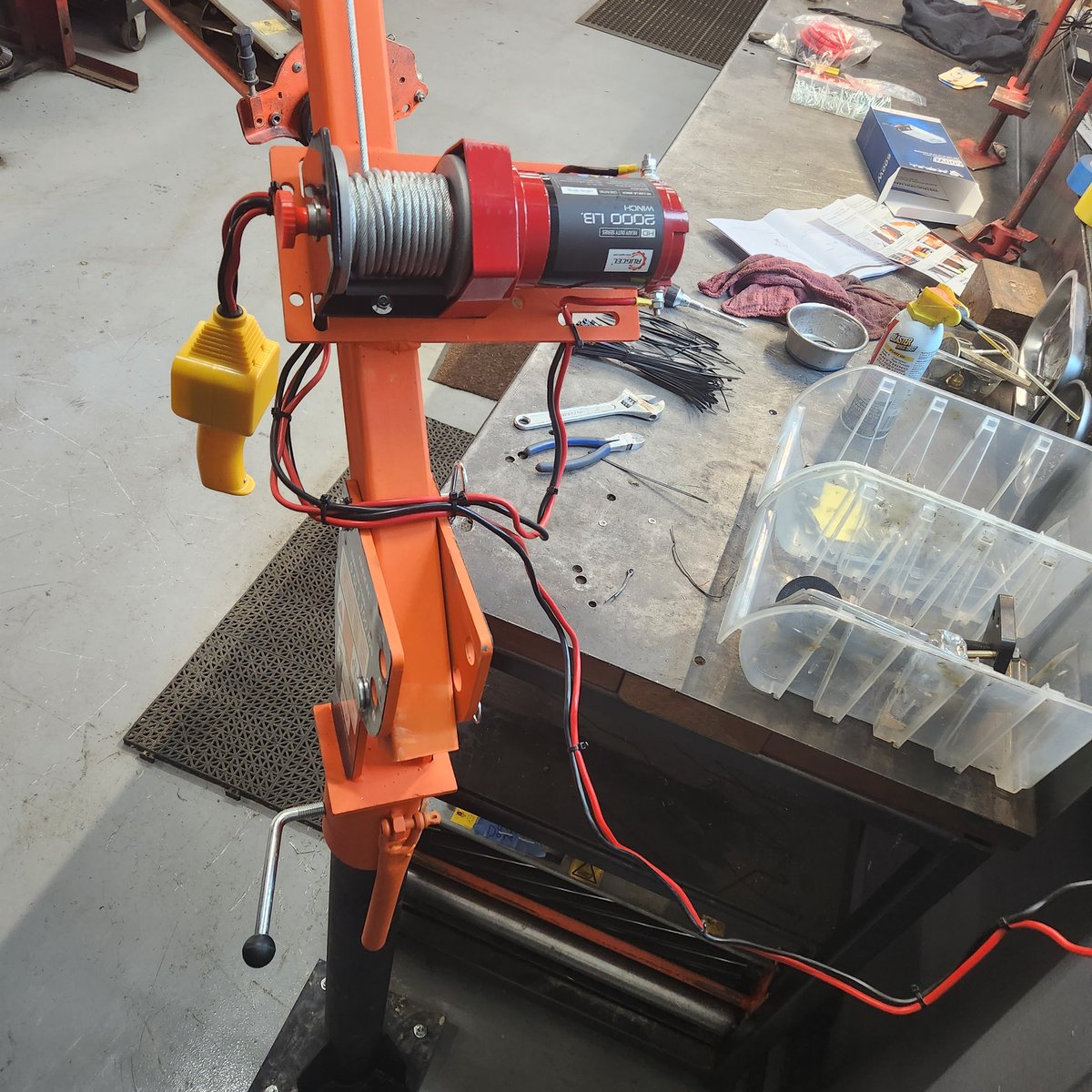 I installed this 12 volt winch today so that our Reel Time workers don't have to lift the cutting reels from the ground to the bench anymore, with their backs. I bought a truck bed winch and post, and a 120 v AC to 12 v DC converter. #efficiency #equipmentmanagement #reeltimework