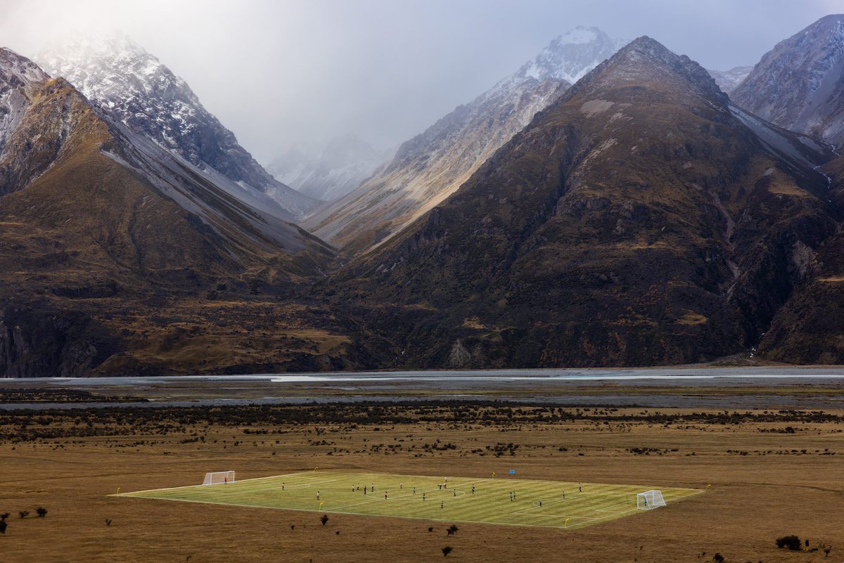 ESPNAusNZ's tweet photo. New Zealand may have just created the most beautiful football pitch in the world 😍

To celebrate #WWC2023, this full sized football pitch was created beneath New Zealand’s highest peak. 

Incredible!

📸 PhibbsVisuals / Tourism NZ https://t.co/EkjtCH0EOk
