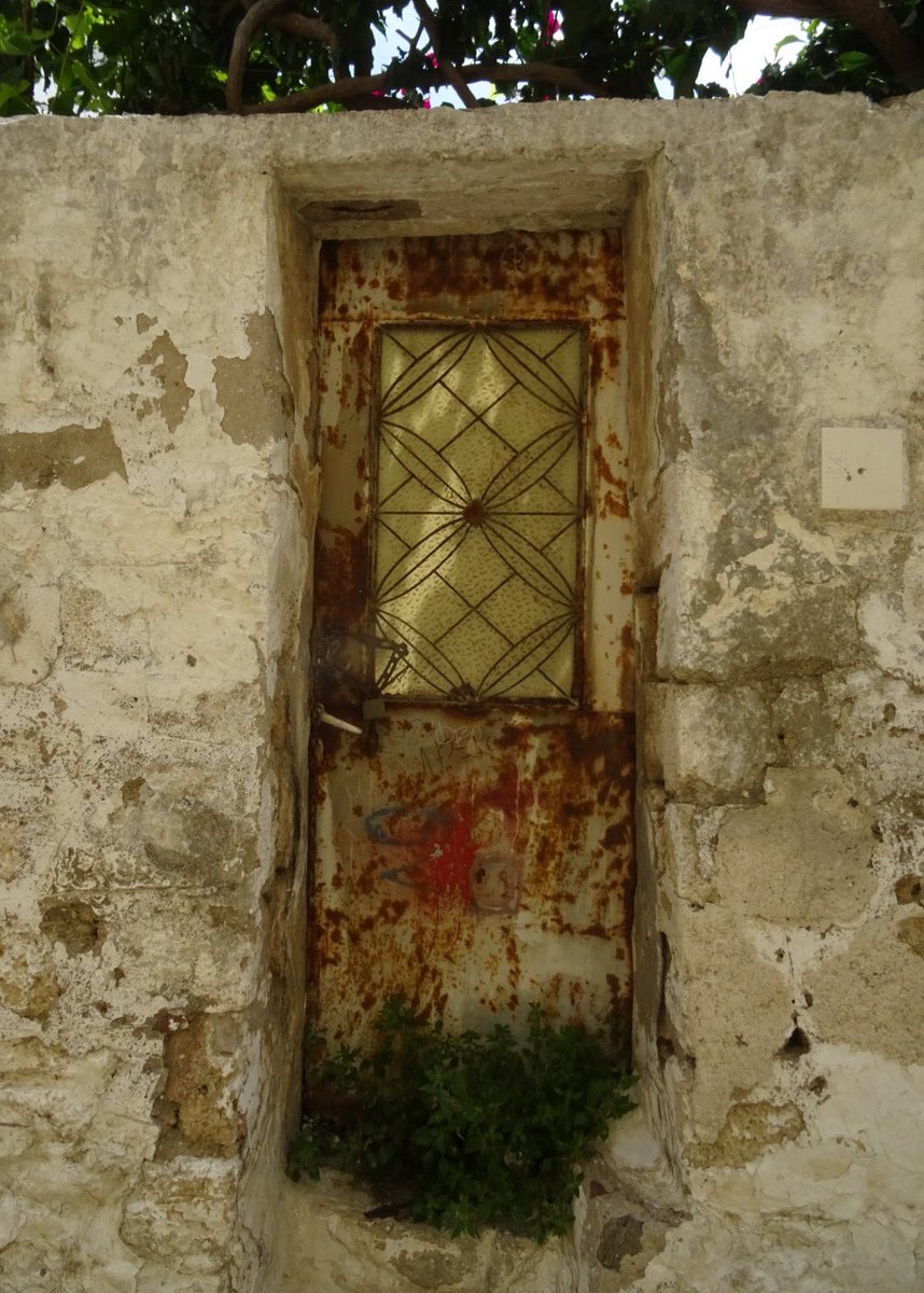 Rusted, chained; now ignored. Once valued enough to pay for premium glazing. #AdoorableThursday Rhodes old town.