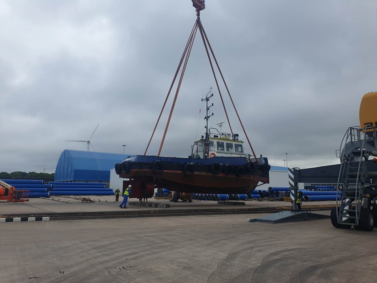 WorkingtonPort's tweet photo. Our pilot/tugboat #derwent is on the quay undergoing its annual spruce up and maintenance. It’s all hands on deck to finish the work on time before the ports #lieberherr crane lifts her back into the water later today. https://t.co/2JQbmKIqzG