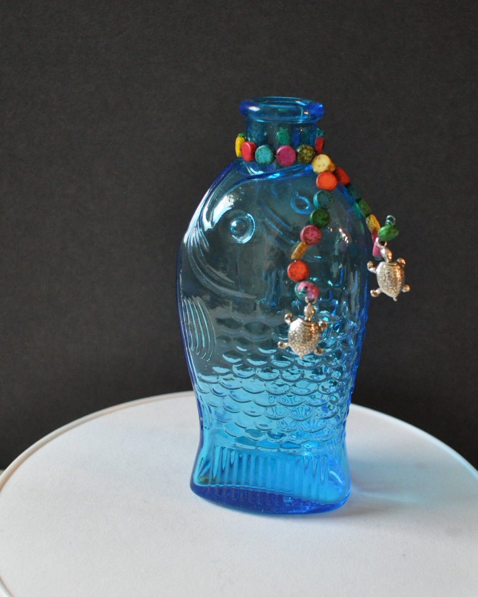 Excited to share the latest addition to my #etsy shop: Fish Repurposed Glass Vase from My 'Under the Sea' Collection etsy.me/3Xl1oPY #blue #silver #coastaltropical #upcycled #beachvase #repurposedbottle #vintagebottle #colescottagecreation #seashoredecor