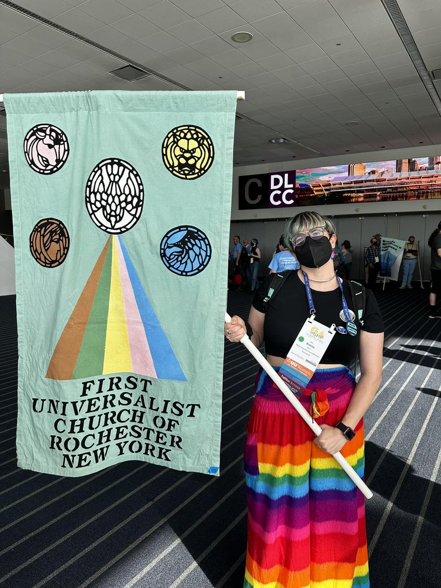 UURoc's tweet image. Check out our awesome office manager, Emma Barry, rocking the @uuroc church banner in the 2023 @uuaGA  banner parade yesterday! 💓 #GeneralAssembly2023 @uua #uua #uuaga #BannerParade