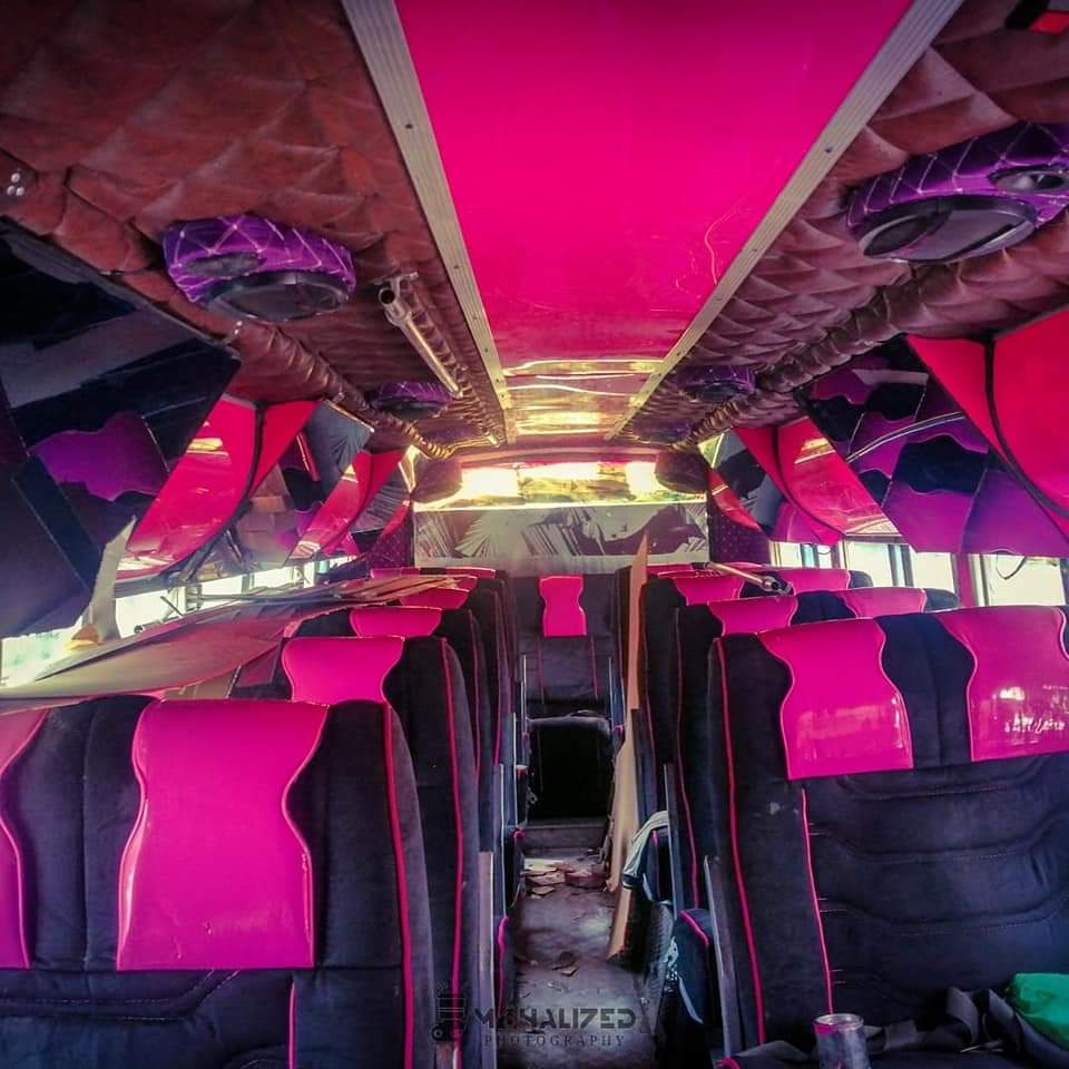 Traditionally designed buses in Nairobi, Kenya.

They are called matatu.