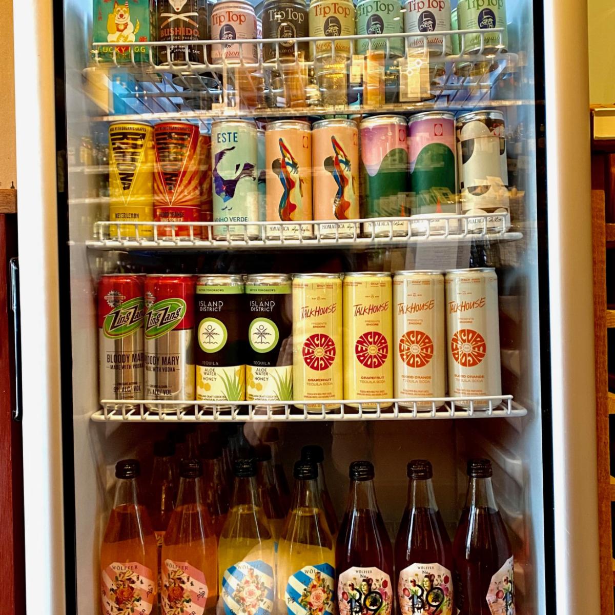Are chiller is bursting with tasty, grab-n-go Ready-to-Drink cocktails, assorted vino, ciders, hard seltzers and even sake! #readytogococktails #luckydogsakibox #tiptopcocktails #nomadics #ramonacocktails #zigzagbloodymary #talkhousecocktails #fisherislandlemonade #islanddistric