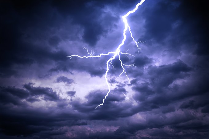 Photo of a thunderstorm among dark coloured clouds.