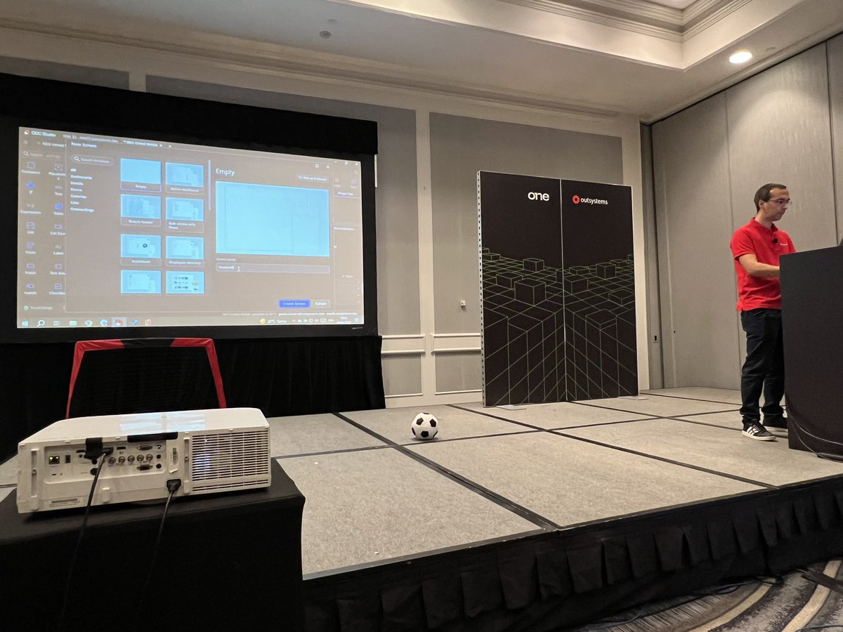 OutSystemsDev's tweet photo. Next up: @poliveira81 has built a new functionality into yesterday’s Neo United ⚽️ app as shown on the main stage. 

Pedro created the ability to play with a virtual soccer ball and score goals via #AugmentedReality through the app!

#ONEOutSystems https://t.co/3Ct9GyQmUX