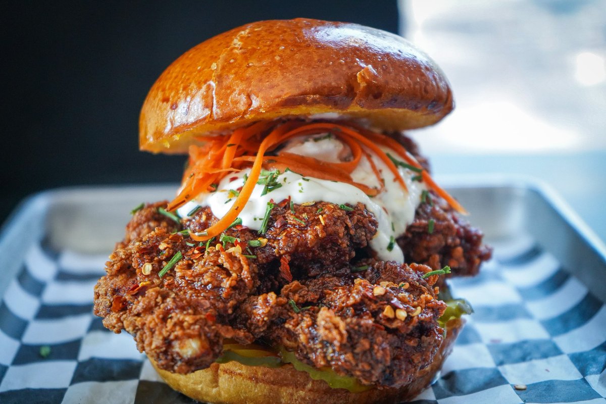 eatinvasion's tweet photo. Looking for a sandwich that will blow your mind? Look no further than "The Bomber" at Invasion! Our buttermilk fried halal chicken, sweet and spicy asian bomb sauce, pickles, sour cream ranch, and pickled carrots on a buttery brioche bun will leave you wanting more.  #Halal https://t.co/gVm7hwXCDI