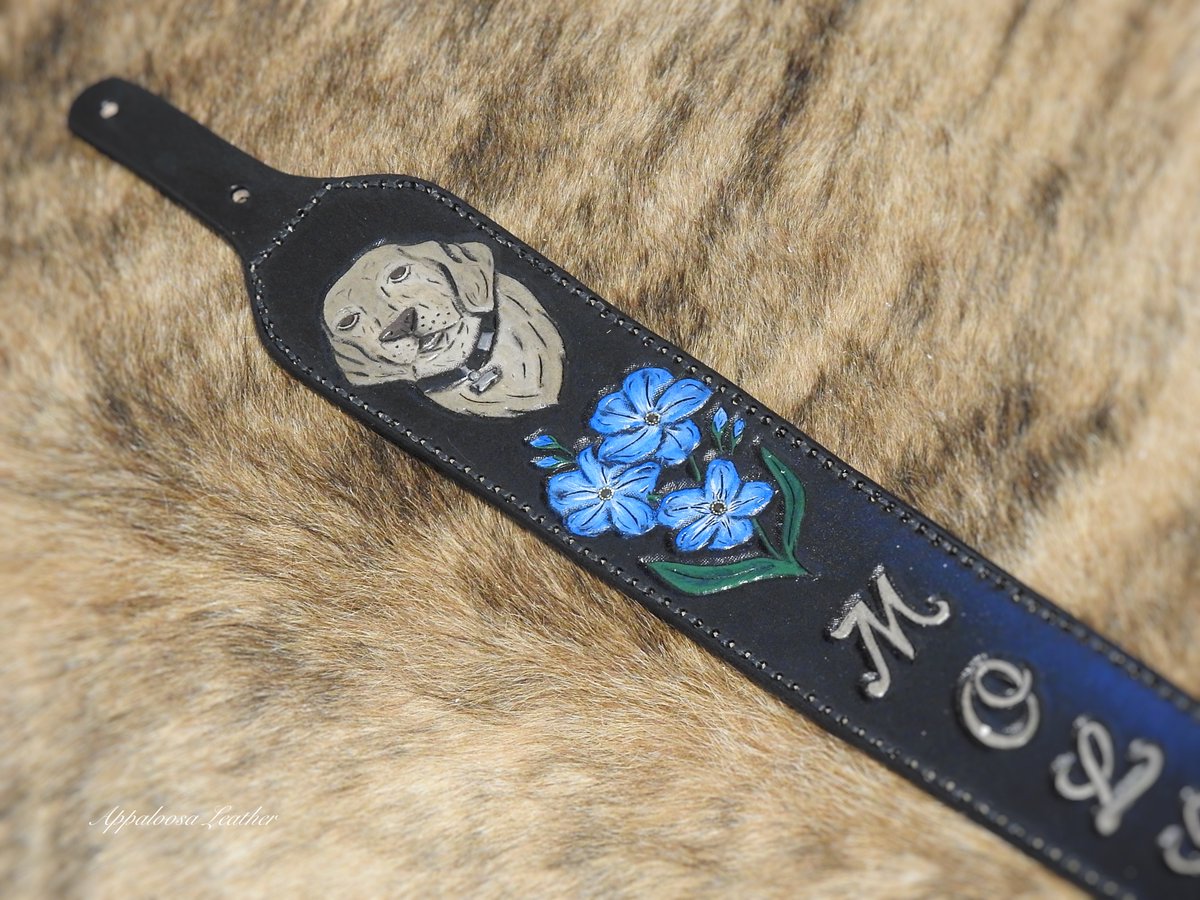 This custom leather rifle sling features a dog portrait of a beloved pet and forget me not flowers.

#girlshunttoo #huntress  #outdoorswoman #girlswhohunt #womenhunttoo #outdoorswoman #forgetmenot #flowers #blueflowers #huntingdog #mansbestfriend #petportrait #dogportrait