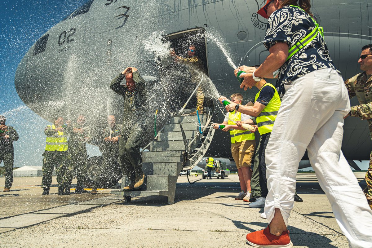 SAC_Program's tweet photo. The Heavy Airlift Wing said goodbye to its Commander with a bang! 💥 🇭🇺 fire trucks creating a water arch over the aircraft was a sight to behold. 🚿🚒 The champagne shower was just the icing on the cake! 🍾🚿 #Farewell  #FiniFlight #AirForceTradition

👉https://t.co/jQS54SyIF7 https://t.co/Ay2FDLB0mL