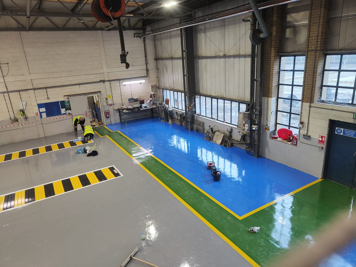 Epoxy resin coatings in a truck workshop.
pbflooring.co.uk