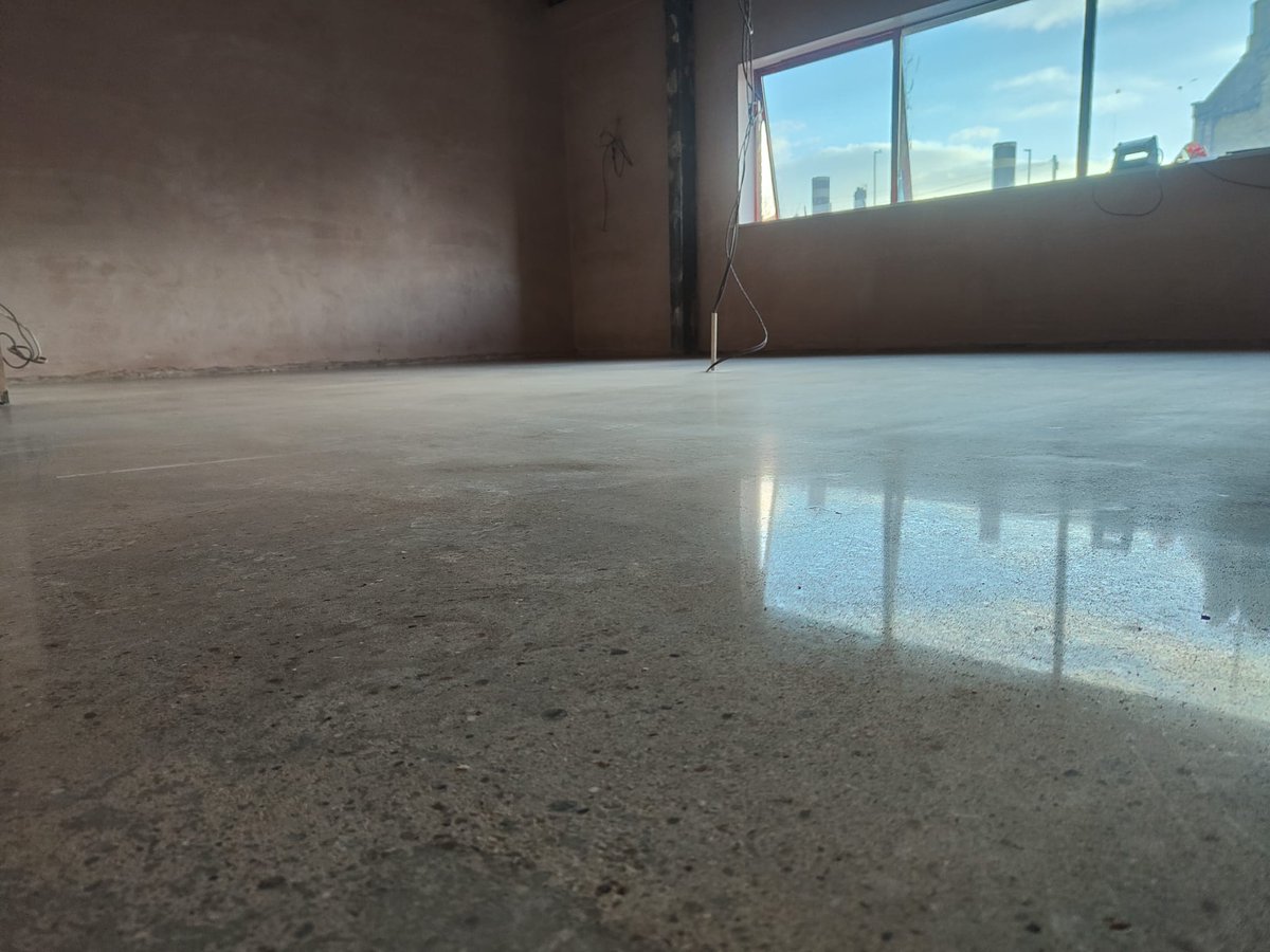 Polished concrete floor in an office setting.
pbflooring.co.uk