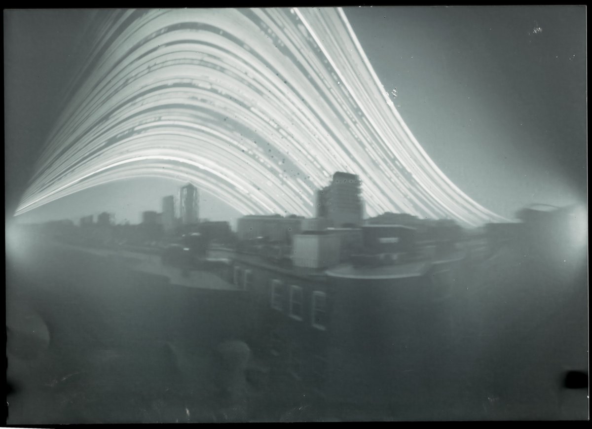 Six months of the Boston skyline.

I put a beer-can pinhole camera on the roof of my building in the North End on the winter solstice. Today, I took it down.