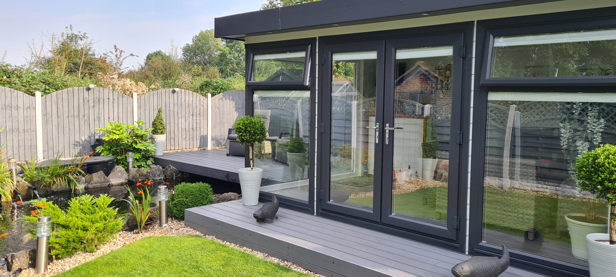 Recently completed project; 4.5M X 3M garden room with panoramic glazing clad in light mist hardie board with composite path and decking. The decking is built over the customers pond. 
#cosygardenrooms #gardenrooms #ukmfg