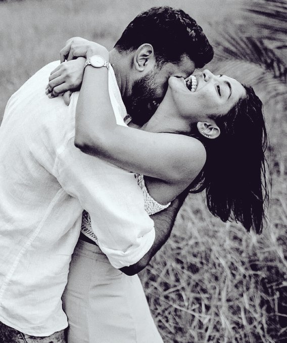 Lost in the mesmerizing radiance of her smile, and intoxicated by the intoxicating symphony of her laughter, I surrendered my heart to an ocean of ardent passion.