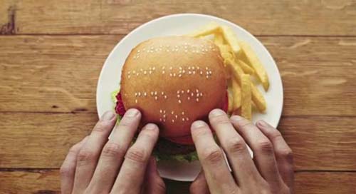 creative_i_p's tweet photo. 【点字】 英国のハンバーガー店「WIMPY」は、バンズのゴマで点字を書いた商品を作成。詳細を言わず視覚障害者に食べてもらうと、商品に触れた瞬間「100% PURE BEEF BURGER MADE FOR YOU」の点字に触れて知ることに。感動した試食者は視覚障害者向けニュースレターやブログで語り、拡散されました。 https://t.co/hmiHUM9DMY