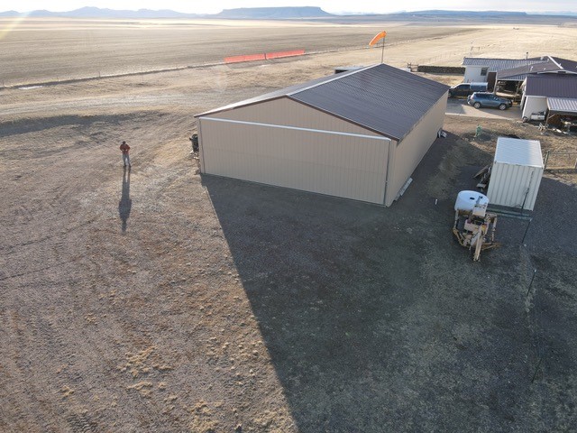 Looks like it was a beautiful day for flying in Montana when this photo was taken! 38'x10' Diamond bi-fold door. #DiamondDoors #privatehangar #privatepilot