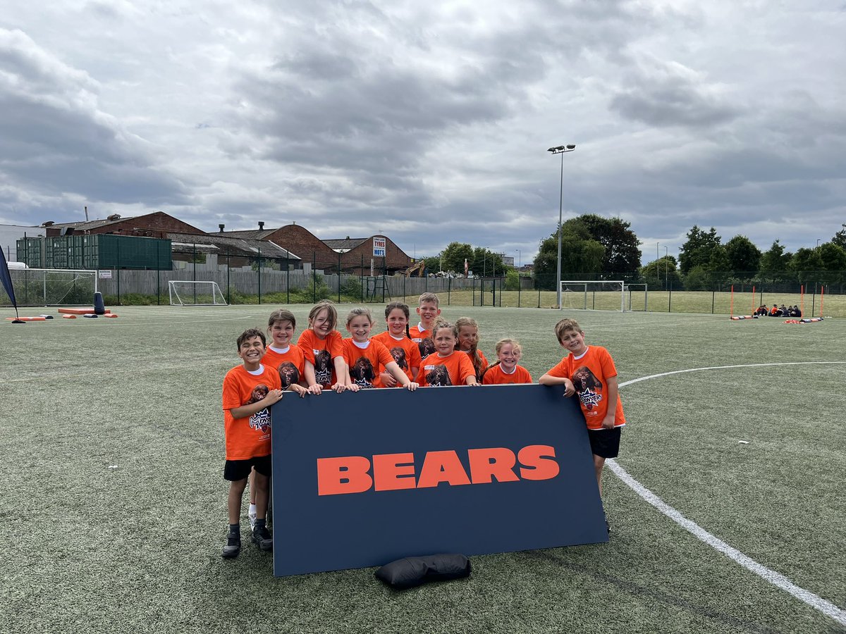 AshKnotty's tweet photo. Some very lucky Year 4s went on the @ChicagoBears #MiniMonsterTour ! It was literally amazing! The children represented the school so well! Super Bowl winner Shaun Gayle and Coach Gustavo Silva were so impressed with our attitudes and determination! #GoKnottyAsh https://t.co/71zLgbJPw6