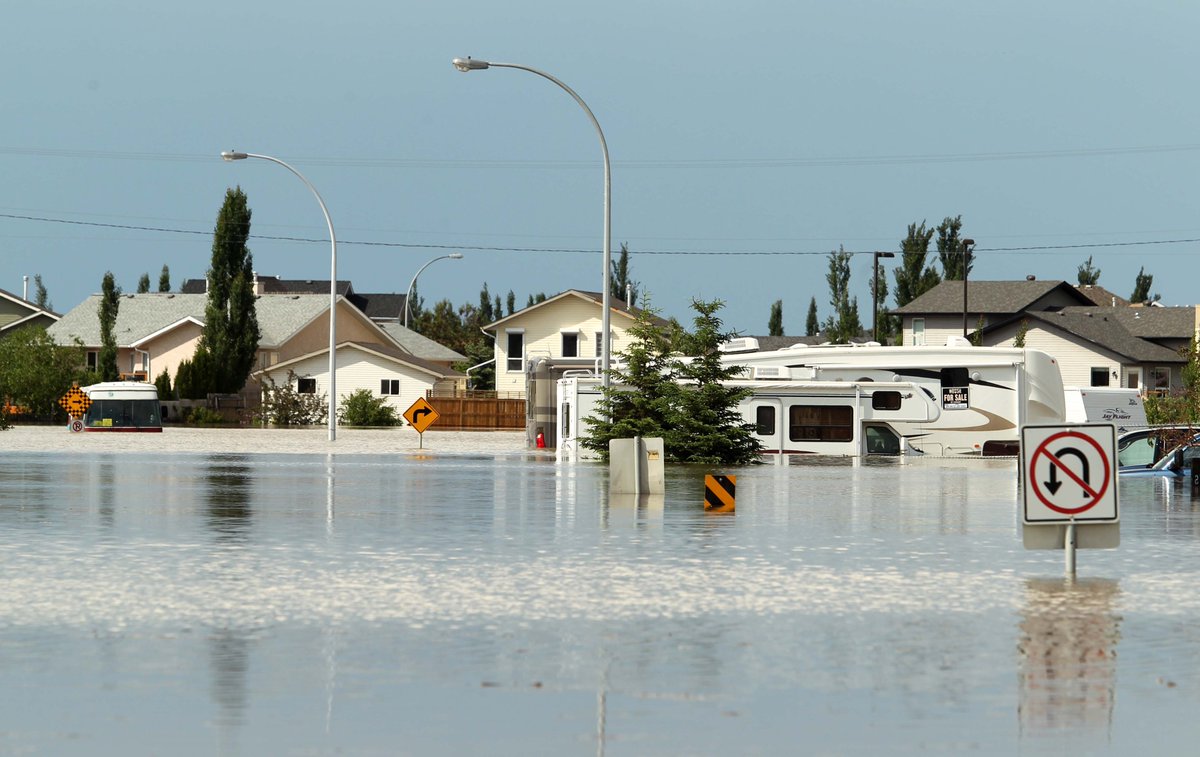 calgaryherald's tweet photo. #FloodFlashback: 10 yrs ago,June 23, 2013; 11:15 a.m-High River still in a state of emergency with 80% of homes without power & services.Anyone still left in town is told to leave."Forever changed - 10 years after the flood" at https://t.co/7ip13tYMb3. #ABflood #CalgaryFlood2013 https://t.co/jXlH3qJRh5