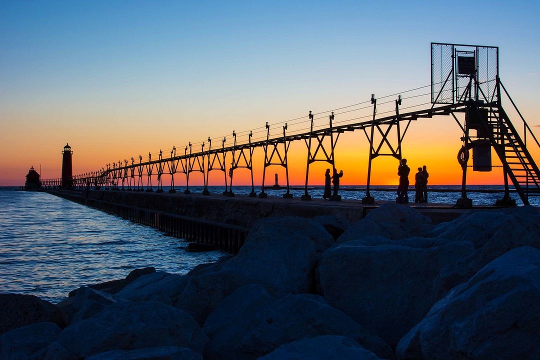 Sunset in Grand Haven: where the sky continues to paint its very own masterpiece. 🌄

#visitgrandhaven #grandhaven #sunsetvibes #grandpier #goldenhourmagic 

📷 : @mibeachtowns 
📍: Grand Haven State Park