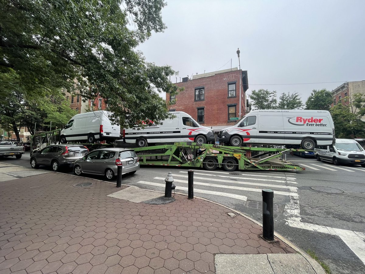 This is what happens when giant trucks use non-truck routes in residential neighborhoods. Two massive flatbeds stuck and two dining sheds smashed.