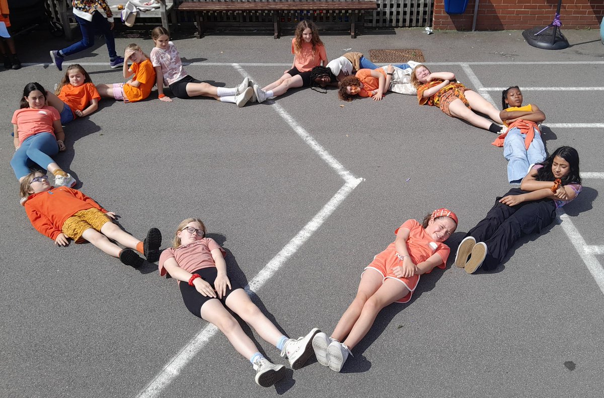 Today we celebrated #RefugeeWeek2023 by wearing something orange. Inspired by 🧡 refugee symbol, we made a 'human' heart.