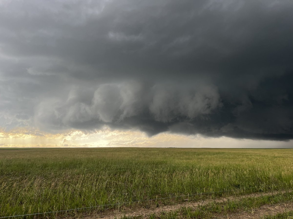 5:31 PM MDT - East of Chugwater, WY. Sub-vortices on the ground. Trying to plant a large cone tornado. #WYwx