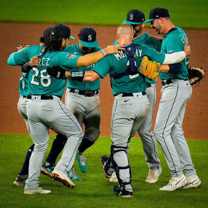 The Mariners dance in the infield after the win.