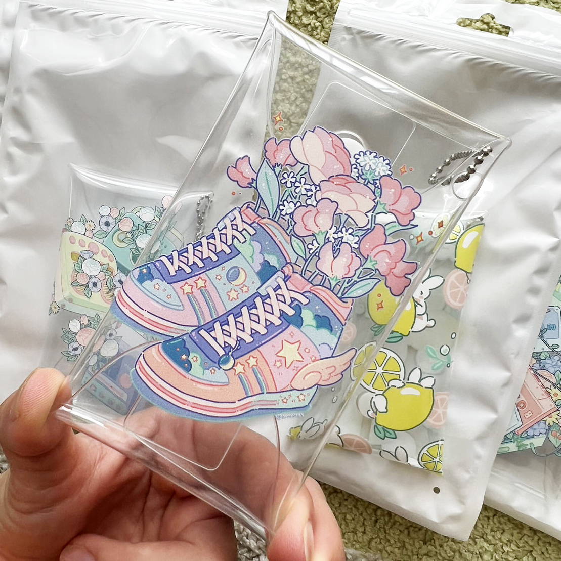 「#NFT縁日 で販売予定のクリアマルチケース 納品準備中・・・」|ヒロコのイラスト