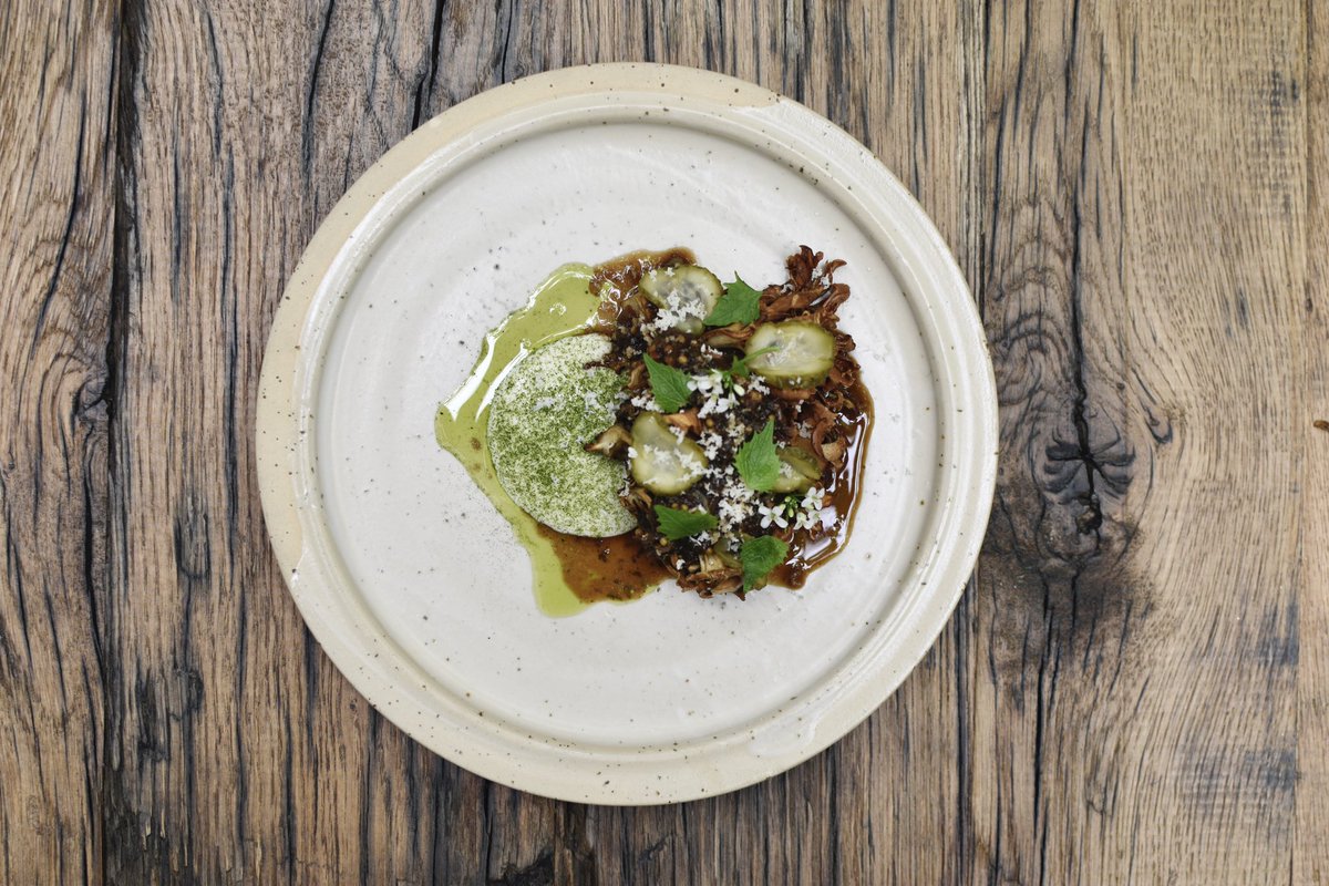 Hen off the woods with a sauce based on black currant leftover. we get the leftovers from the Nevel brewery. We store the fruit for another month at 60* to give it a little umami kick so it's fits the flavor profile off the mushroom. served with some pickels and a peppery oil.