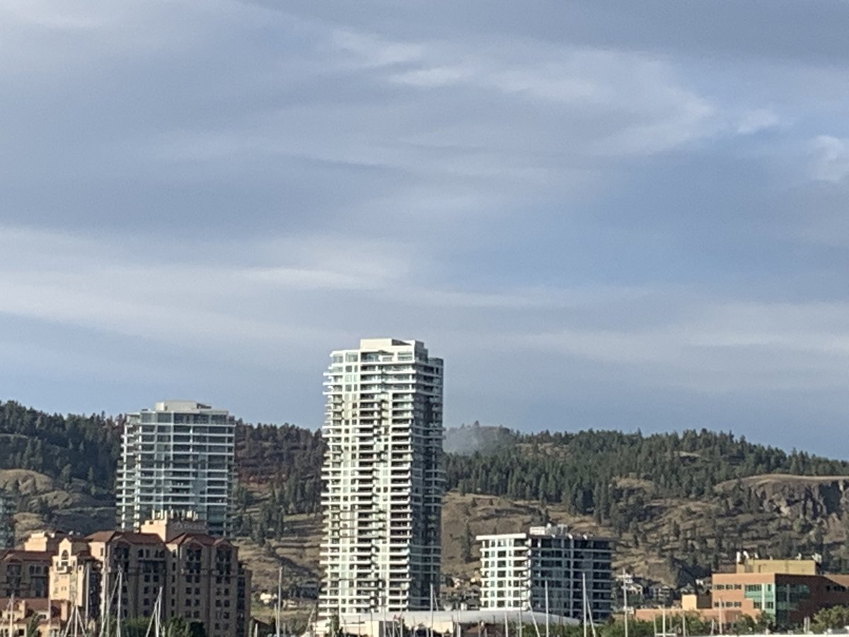 RCMP on the beach in #Kelowna’s City Park are telling people that the fireworks are cancelled. It’s very windy down here. We can see the smoke from the Knox Mountain fire burning in the background