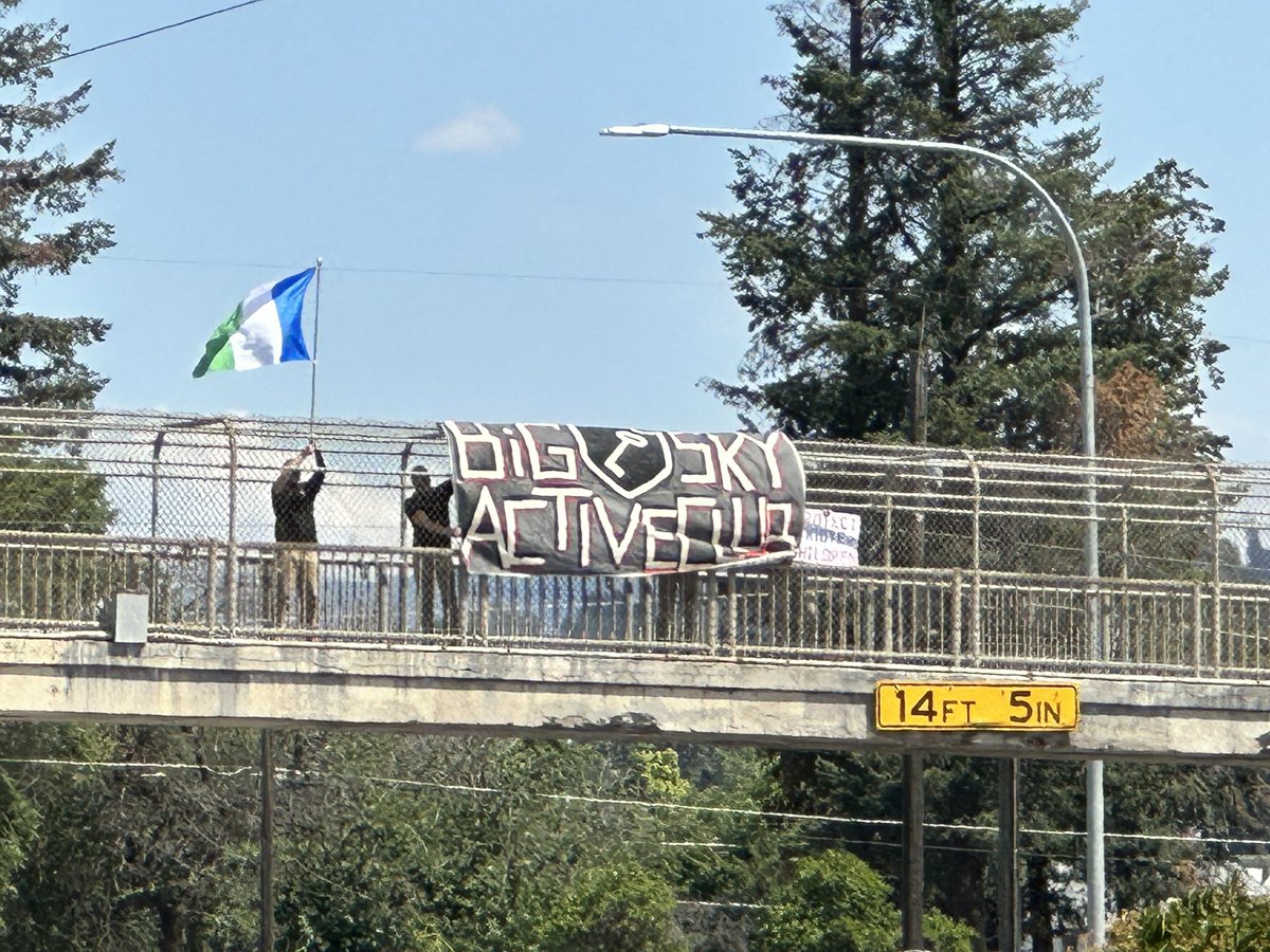 SpokaneStronger's tweet photo. This happened in Spokane today. They were harassing folks at Pride on Perry. I decided to head down to help keep things safe when I spotted the group on the Thor overpass. https://t.co/3nFMBJxVZk