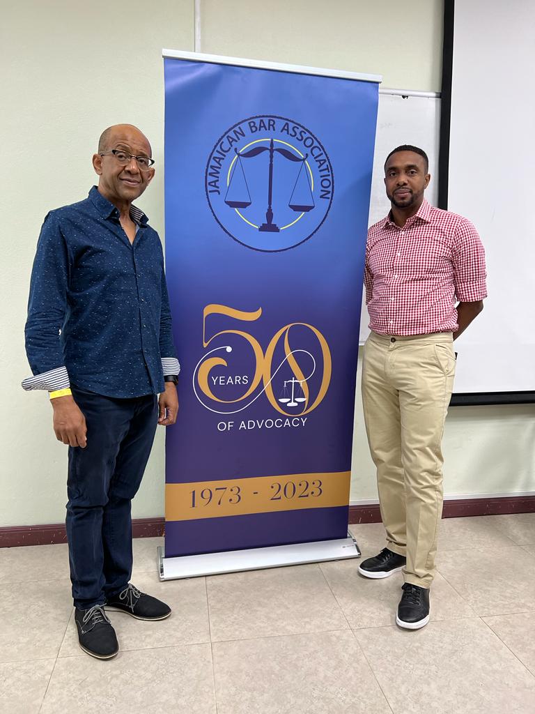 Congrats to the new JBA President Mr. John Bassie and Vice President Mr. Kevin Powell👏⚖️✨️! Posing today beside the JBA50 banner at the 42nd AGM held at the Norman Manley Law School Lecture Theatre  #jba50 #agm #changingoftheguard