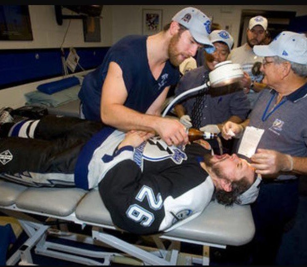 NHLhistorygirl's tweet photo. Martin St. Louis getting stitches and celebratory beer at the same time https://t.co/zsk4xhgo7X