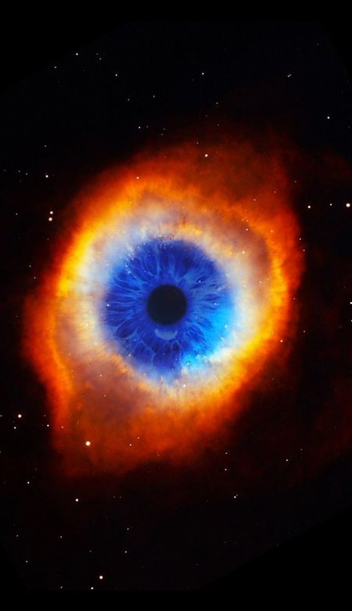 Composition of NGC7293 Helix Nebula and human iris (The eye of God) by Nebula images.