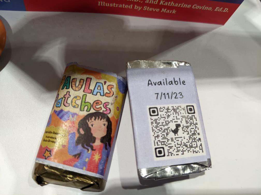 Paula’s Patches at #ALAAC23 #ALAAC2023 
(And there are chocolates because @FreeSpiritBooks is amazing like that)

#PaulaInTheWorld