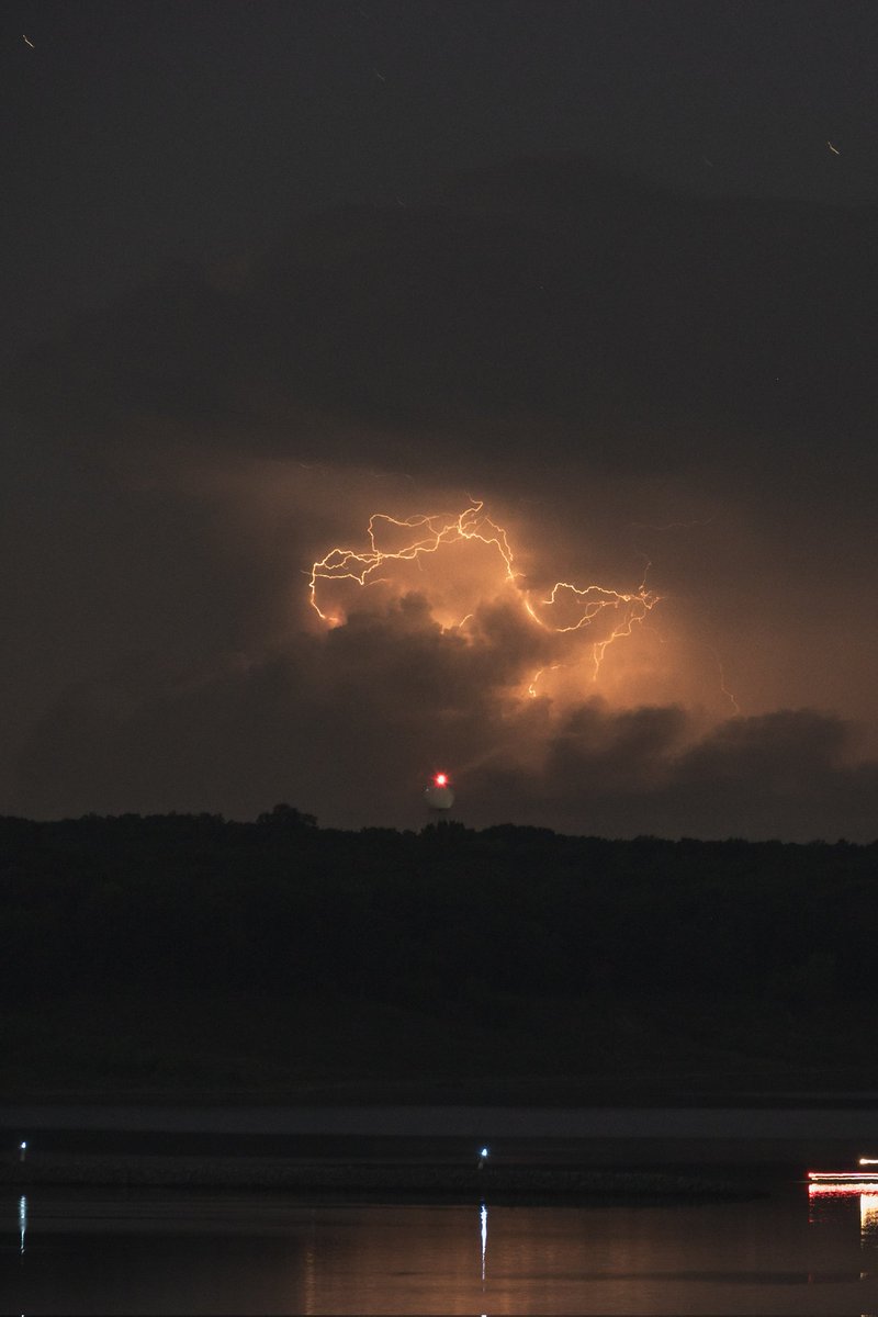 Tornado warned supercell from over 90 miles away with the @NWSDesMoines doppler radar in the foreground! The amount of lightning this storm started producing before it became tornado warned was absurd! #iawx #wxtwitter