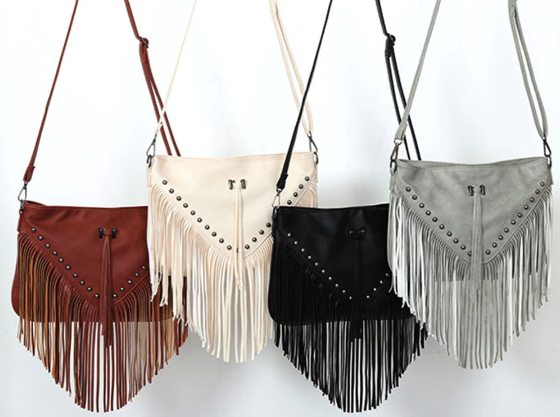 etsy.me/43WEIrX #tasselhandbags #fauxleatherbags #leatherpurses #cutewomensbags #shoulderbags #fringepurse #tasselbags #crossbodybags #countrychic #westerntasselpurse #womenshandbags #cutegirlspurses #countrywestern #adjustablestraps #pursesforwomen #leatherbag