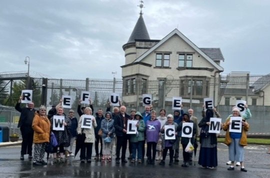 justcarol12's tweet photo. At Dungavel today for a solidarity gathering remembering all Asylum Seekers detained behind those bars. Moving speech by Archbishop Nolan Thanks to @Arthurwest7West for organising & @JandPScotland #RefugeesWelcome #RefugeesWelcome #CloseDungavel https://t.co/FVua1UgfGX