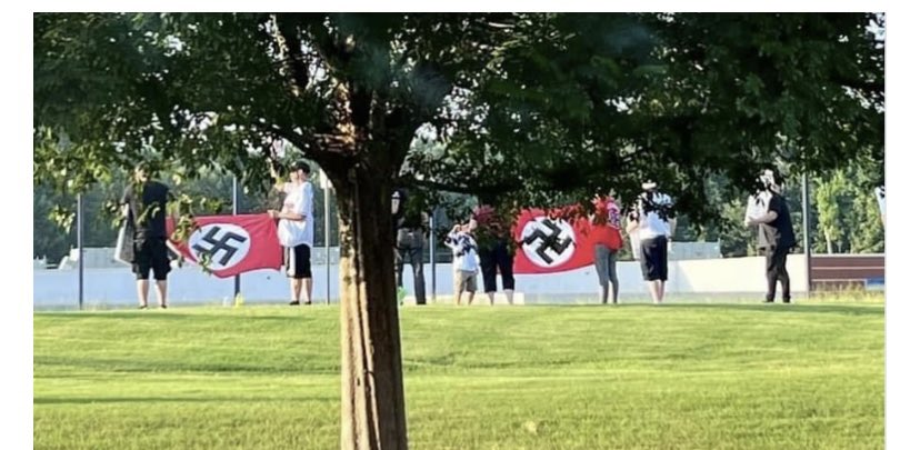 Neo Nazi waving swastika flags outside a Cobb County, Georgia synagogue.  The police were fine with it, claiming freedom of speech.  What the f**k kind of world are we living in.