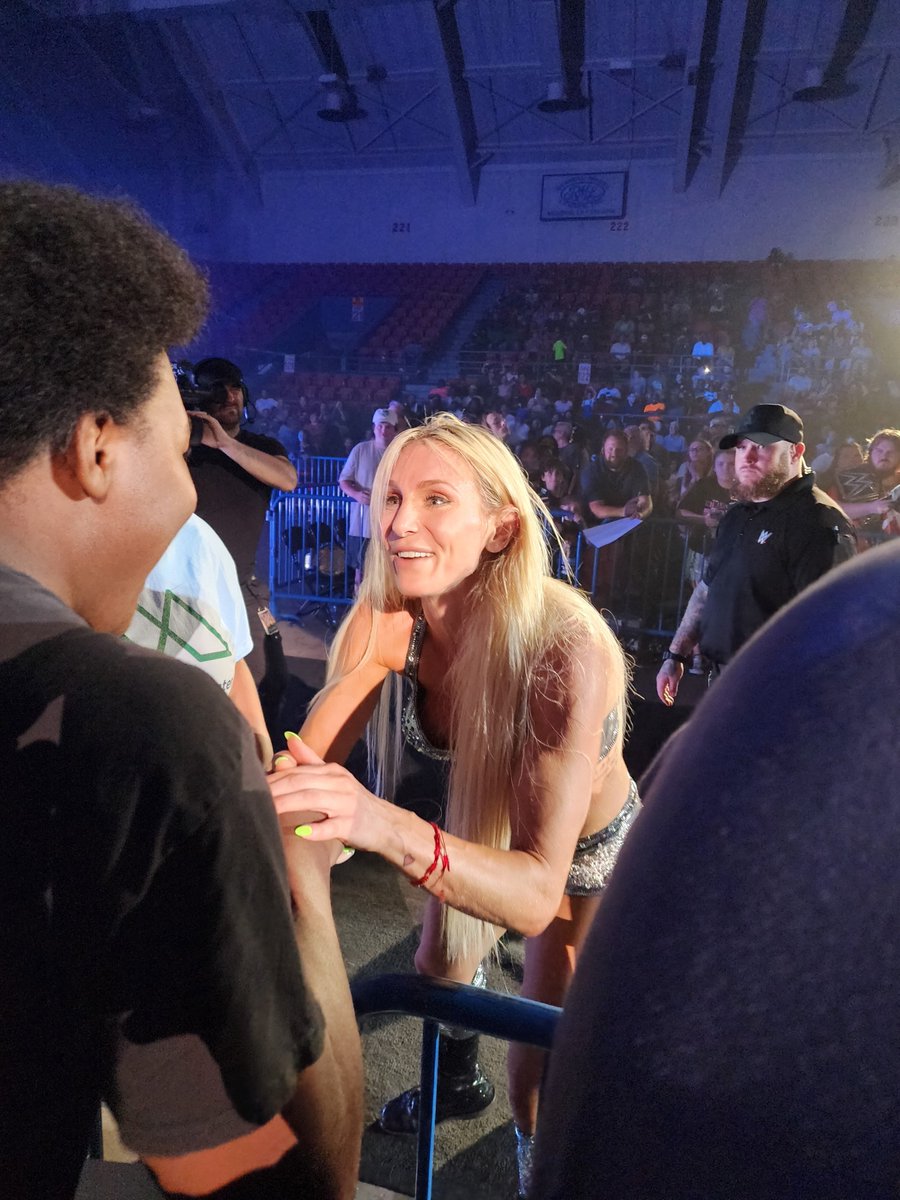 @MsCharlotteWWE arrives at #WWEMonroe and then locks in the #figure8leglock to win against @itsBayleyWWE. @YOUNGBLACK_MAN shares a moment with her after the match.