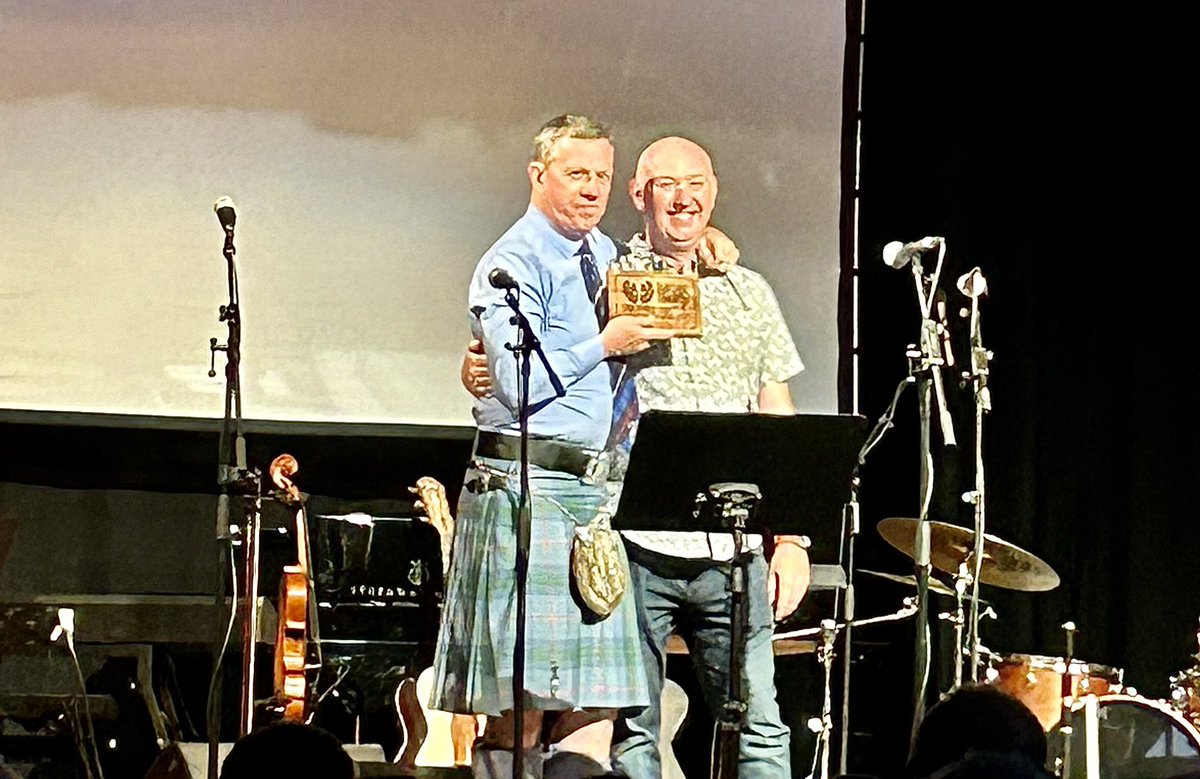 Sgoil Chiùil na Gàidhealtachd (@plocktonmusic) on Twitter photo 📢 Dougie Pincock inducted into the Scottish Traditional Music Hall of Fame for ‘Services to Community’.
We welcomed Simon Thoumire from <a href="/handsupfortrad/">Hands Up For Trad</a> to our summer concert last night to present Dougie with his plaque of recognition and announce his induction! 📢 Dougie Pincock inducted into the Scottish Traditional Music Hall of Fame for ‘Services to Community’.
We welcomed Simon Thoumire from <a href="/handsupfortrad/">Hands Up For Trad</a> to our summer concert last night to present Dougie with his plaque of recognition and announce his induction!