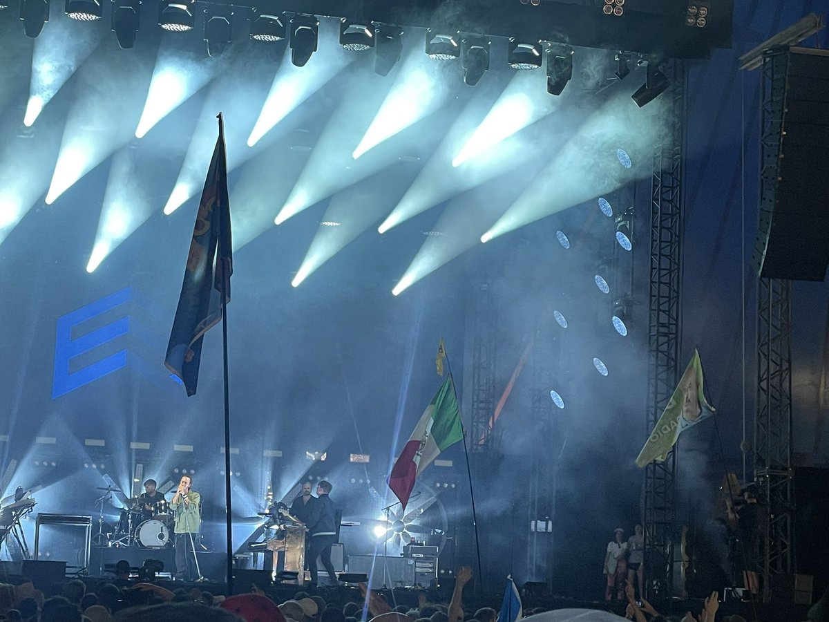 Zixtii's tweet photo. @domisatwit  trying his best is very not windy 🌬️ woodies tent @editorsofficial! From an ex Dom holder to another!! @RadioX #radioxflags https://t.co/ATca2gK5rF