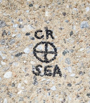 The landing spot of Cal Raleigh’s home run is marked with a circle and the letters “CR - SEA” on Eutaw Street, where a permanent medallion will be installed commemorating the homer.