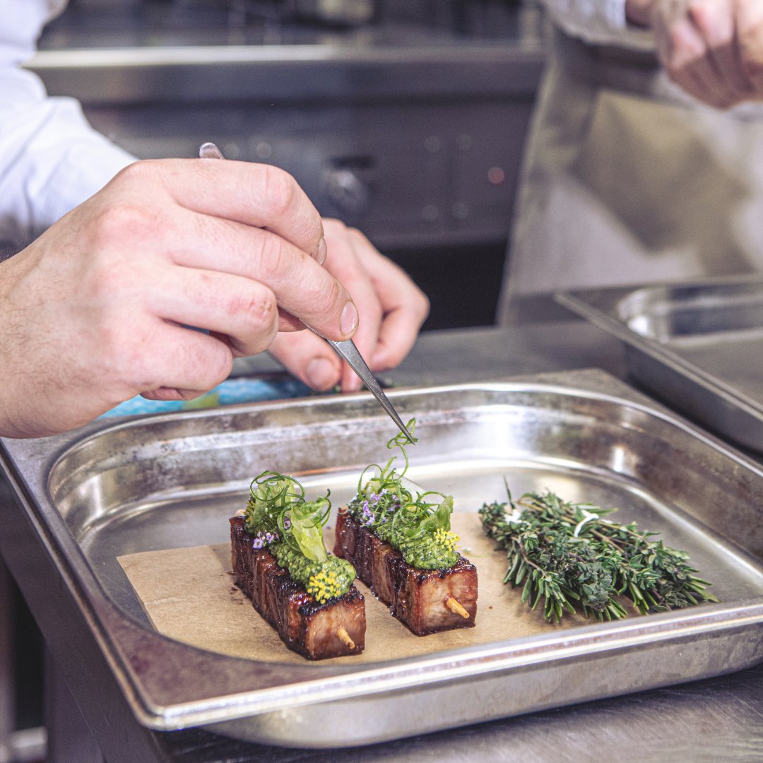 Inverurie lamb belly which we BBQ and brush with a soy glaze, finished on top with herb miso pesto and pickled gem lettuce. Served alongside a wild mushroom consomme and bouquet garni of fresh herbs.